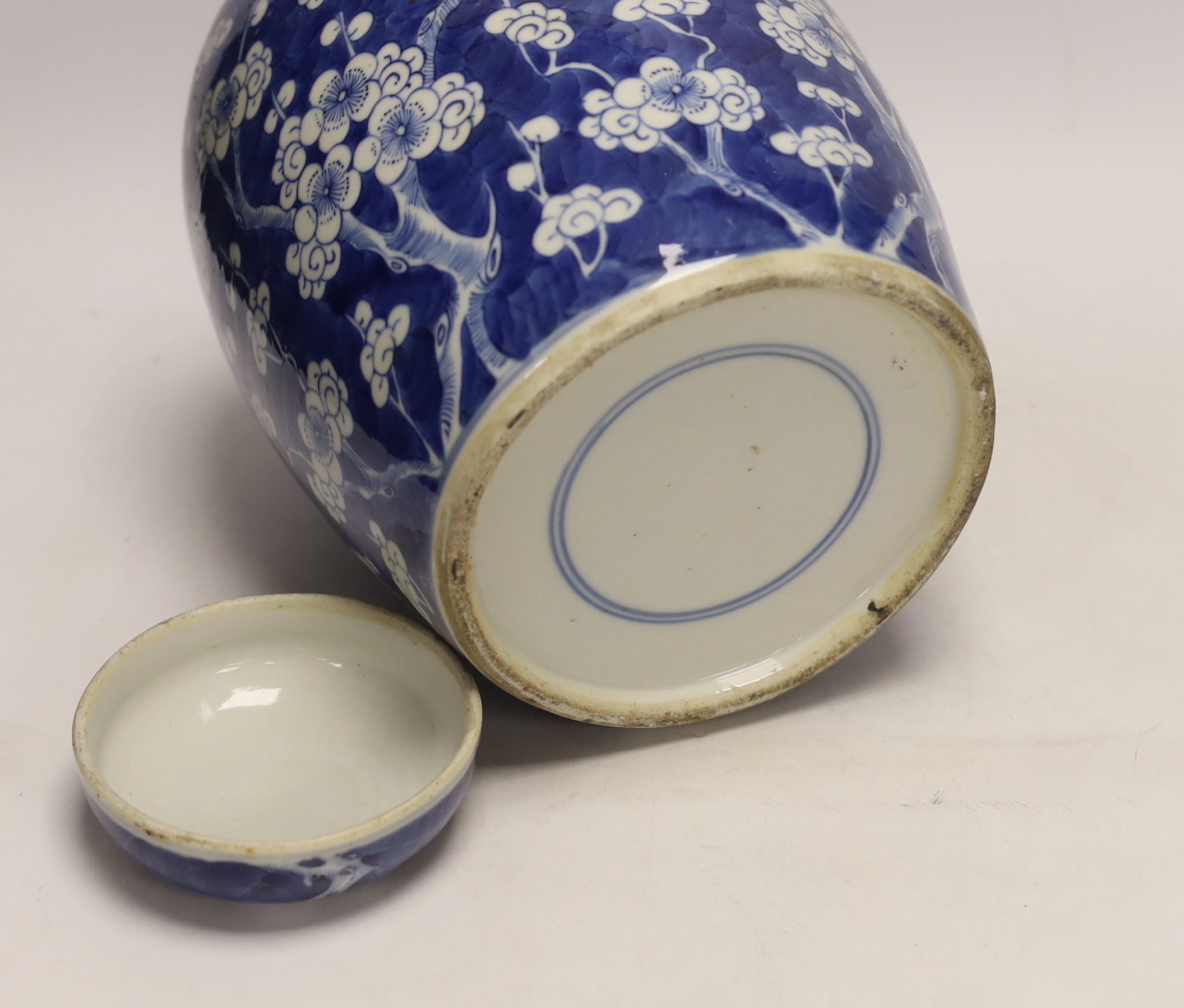 A Chinese blue and white prunus jar and cover, late 19th/early 20th century, 29cm high